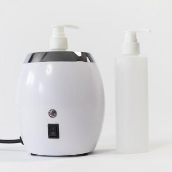 Lumi massage oil warmer with pump bottle